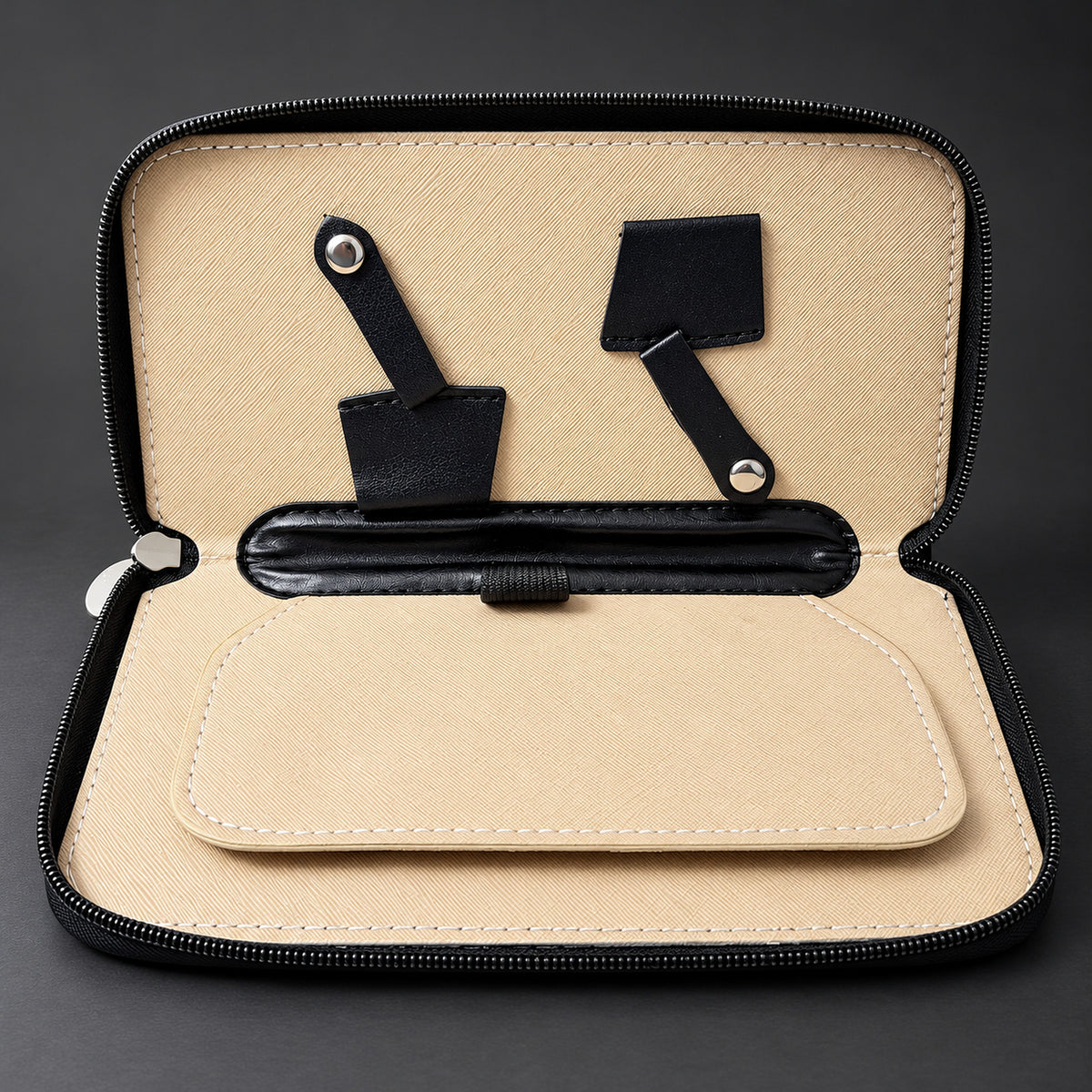 Open Ichiro travel case showing the beige lining, padded divider and press-stud scissor straps
