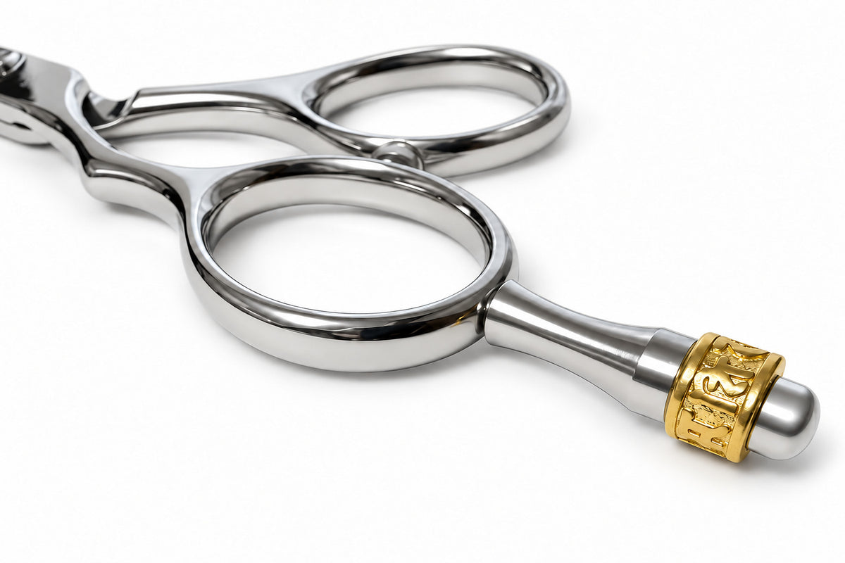 Gold-tone crown finger rest close-up from the left-handed Ichiro Crown scissor set